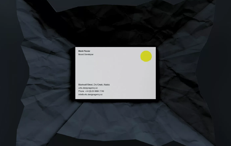 Business card mockup resting on a soft paper background with customizable design