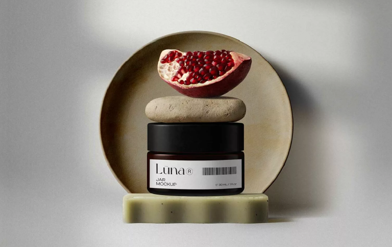 Cosmetic jar mockup with customizable label and fresh pomegranate elements